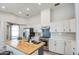 Bright kitchen with butcher block island, stainless appliances, and white cabinetry at 17526 W Coyote Trail Dr, Goodyear, AZ 85338