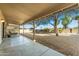 Outdoor patio area with desert landscaping and desert trees at 1847 Leisure World --, Mesa, AZ 85206