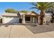 Charming single-story home showcasing a well-manicured front yard and a convenient two-car garage at 1847 Leisure World --, Mesa, AZ 85206