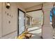Inviting covered front porch featuring a stylish welcome mat and decorative exterior lighting at 1847 Leisure World --, Mesa, AZ 85206