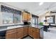 Bright kitchen features ample counter space, wood cabinets, and a window overlooking the backyard at 1847 Leisure World --, Mesa, AZ 85206