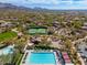 Aerial view of community featuring tennis court, playground, and pool at 18519 N 94Th St, Scottsdale, AZ 85255