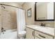 This bathroom features a single sink vanity, a large mirror, and a tub with a shower at 18519 N 94Th St, Scottsdale, AZ 85255