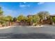 This community entrance features a decorative gate and desert landscaping at 18519 N 94Th St, Scottsdale, AZ 85255