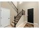 Welcoming foyer featuring a staircase with iron railings and a stylish front door at 18519 N 94Th St, Scottsdale, AZ 85255