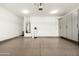 This garage has an epoxy floor with built-in storage cabinets and a water heater at 18519 N 94Th St, Scottsdale, AZ 85255