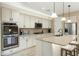 Well-equipped kitchen featuring stainless steel appliances, a large island, and ample cabinet space at 18519 N 94Th St, Scottsdale, AZ 85255