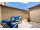 Furnished patio space with blue cushions and a gray-tone outdoor rug at 18519 N 94Th St, Scottsdale, AZ 85255