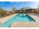 Community pool with lounge chairs and pergola for relaxing in the sun at 18519 N 94Th St, Scottsdale, AZ 85255