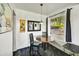 Cozy dining room with a round table, natural light, and modern decor elements at 2045 W Orange Dr, Phoenix, AZ 85015