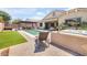 Expansive backyard featuring artificial turf, a pool, mature landscaping, a hot tub, and covered patios at 20520 E Mockingbird Dr, Queen Creek, AZ 85142