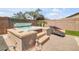 Inviting hot tub surrounded by mature landscaping and a private outdoor space at 20520 E Mockingbird Dr, Queen Creek, AZ 85142