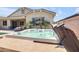 Inviting hot tub surrounded by mature landscaping and a private outdoor space at 20520 E Mockingbird Dr, Queen Creek, AZ 85142