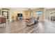 Bright and spacious living area with wood-look floors and plenty of space for relaxing and entertaining at 20520 E Mockingbird Dr, Queen Creek, AZ 85142