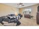Relaxing main bedroom featuring a plush bed, a dresser, and a comfortable massage chair at 20520 E Mockingbird Dr, Queen Creek, AZ 85142