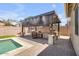 Backyard outdoor kitchen and bar area offering a perfect space for entertaining at 20520 E Mockingbird Dr, Queen Creek, AZ 85142