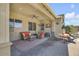 Covered patio with a ceiling fan and comfortable seating, perfect for outdoor relaxation and entertaining at 20520 E Mockingbird Dr, Queen Creek, AZ 85142