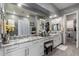 Bathroom featuring double sinks, granite countertop, and a walk-in shower at 20652 W Clearstream Dr, Buckeye, AZ 85396