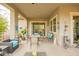 Comfortable, covered patio with ample seating and views of the private backyard at 20652 W Clearstream Dr, Buckeye, AZ 85396