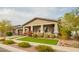 Charming home with a two-car garage, well-maintained landscaping, and a welcoming front porch at 20652 W Clearstream Dr, Buckeye, AZ 85396