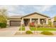 Charming home with a two-car garage, well-maintained landscaping, and a welcoming front porch at 20652 W Clearstream Dr, Buckeye, AZ 85396