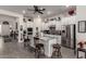 Bright kitchen featuring a center island with barstool seating and stainless steel appliances at 20652 W Clearstream Dr, Buckeye, AZ 85396