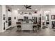 Bright kitchen featuring a center island with barstool seating and stainless steel appliances at 20652 W Clearstream Dr, Buckeye, AZ 85396