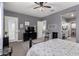 Comfortable bedroom with gray walls and carpet flooring. En suite bathroom is visible at 20652 W Clearstream Dr, Buckeye, AZ 85396