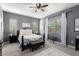 Comfortable bedroom with gray walls, carpet flooring, and coordinated decor at 20652 W Clearstream Dr, Buckeye, AZ 85396