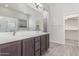 Bathroom features a double vanity, large mirror, and a separate shower stall at 21090 E Camina Buena Vis, Queen Creek, AZ 85142