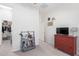 Bedroom featuring a dresser, tv, and walk in closet in a home at 21090 E Camina Buena Vis, Queen Creek, AZ 85142