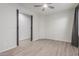 Bedroom features wood-look flooring, neutral walls, and ample space at 21090 E Camina Buena Vis, Queen Creek, AZ 85142