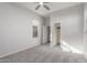 Bedroom with neutral walls, plush carpet, and a closet; bright and airy at 21090 E Camina Buena Vis, Queen Creek, AZ 85142