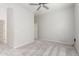 Bedroom featuring plush carpet, neutral walls, ceiling fan, and closet at 21090 E Camina Buena Vis, Queen Creek, AZ 85142