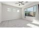 Bedroom boasts carpeting and a wall of windows for bright, natural light at 21090 E Camina Buena Vis, Queen Creek, AZ 85142