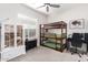 Bedroom with bunk beds, a desk, and a white cabinet with glass doors at 21090 E Camina Buena Vis, Queen Creek, AZ 85142