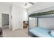 This bedroom features a bunk bed, a storage area, and neutral colored walls at 21090 E Camina Buena Vis, Queen Creek, AZ 85142