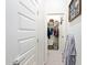 This hallway features access to a walk-in closet for easy storage at 21090 E Camina Buena Vis, Queen Creek, AZ 85142