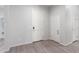 Bright entryway showcasing tile floors and a modern design with a coat closet and a door to the garage at 21090 E Camina Buena Vis, Queen Creek, AZ 85142