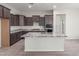 Modern kitchen boasts granite countertops, stainless steel appliances, and plenty of cabinet storage at 21090 E Camina Buena Vis, Queen Creek, AZ 85142
