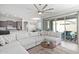Spacious living room with an open floor plan, seamlessly connecting to the kitchen and dining area at 21090 E Camina Buena Vis, Queen Creek, AZ 85142