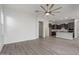 Spacious living area with tile floors, neutral paint, and seamless flow into a kitchen and dining space at 21090 E Camina Buena Vis, Queen Creek, AZ 85142