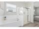 Well-lit primary bath featuring a tub and separate shower at 21090 E Camina Buena Vis, Queen Creek, AZ 85142