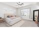 Bright main bedroom featuring neutral tones, plush carpeting, and lots of natural light at 21090 E Camina Buena Vis, Queen Creek, AZ 85142