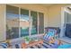 Inviting outdoor patio area with comfortable seating, a view of the pool, and an entertainment area at 21090 E Camina Buena Vis, Queen Creek, AZ 85142