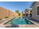 A stunning swimming pool surrounded by a well-kept backyard, perfect for relaxation and outdoor enjoyment at 21090 E Camina Buena Vis, Queen Creek, AZ 85142