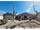 Charming home featuring desert landscaping, a tile roof, and a well-maintained yard at 21901 N Sonora Ln, Sun City West, AZ 85375