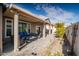 Relaxing covered patio with brick flooring and comfortable outdoor seating at 21901 N Sonora Ln, Sun City West, AZ 85375