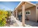 Covered patio featuring a built-in grill and view of well maintained landscaping at 21901 N Sonora Ln, Sun City West, AZ 85375