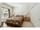 Cozy bedroom with neutral tones, a window with blinds, and closet at 2214 W Muirfield Dr, Anthem, AZ 85086